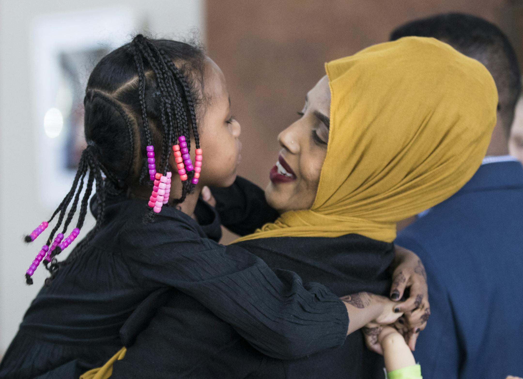 Mushkaad Abdi, 4, held tight to her mother Samira Dahir after a press conference about the process of getting Mushkaad approved to join her mother in the U.S. at Lutheran Social Services in Minneapolis, Minn., on Friday, February 3, 2017. ] RENEE JONES SCHNEIDER • renee.jones@startribune.com