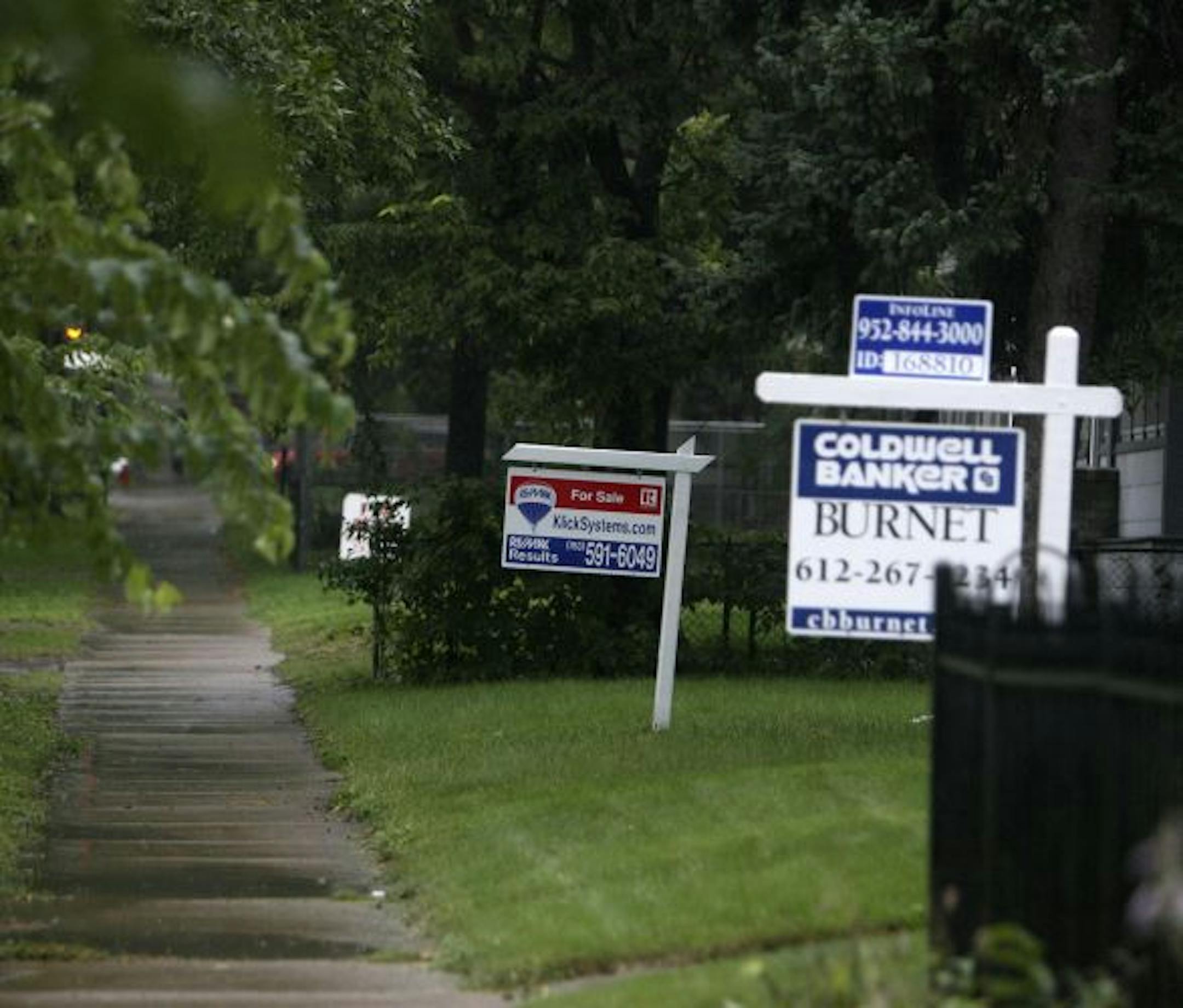 For sale signs dotted the lawns of homes along Lyndale Avenue in Minneapolis.