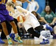 Lynx point guard Lindsay Whalen (13) attempted to dribble past a Sparks defender in the first quarter.