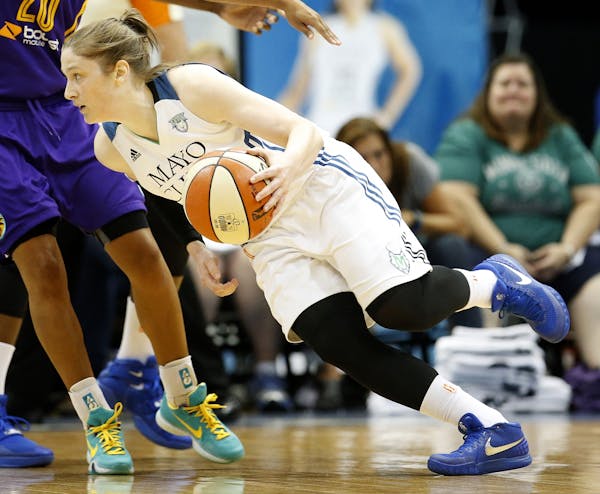 Lynx point guard Lindsay Whalen (13) attempted to dribble past a Sparks defender in the first quarter.