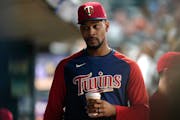 Minnesota Twins' Byron Buxton looks on from the dugout during the seventh inning of a baseball game against the San Francisco Giants Friday, Aug. 26, 
