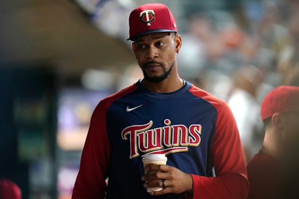 Minnesota Twins' Byron Buxton looks on from the dugout during the seventh inning of a baseball game against the San Francisco Giants Friday, Aug. 26, 
