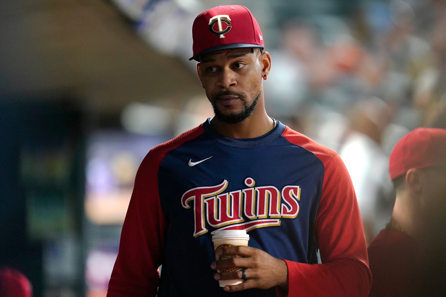 Minnesota Twins' Byron Buxton looks on from the dugout during the seventh inning of a baseball game against the San Francisco Giants Friday, Aug. 26, 2022, in Minneapolis. (AP Photo/Abbie Parr)