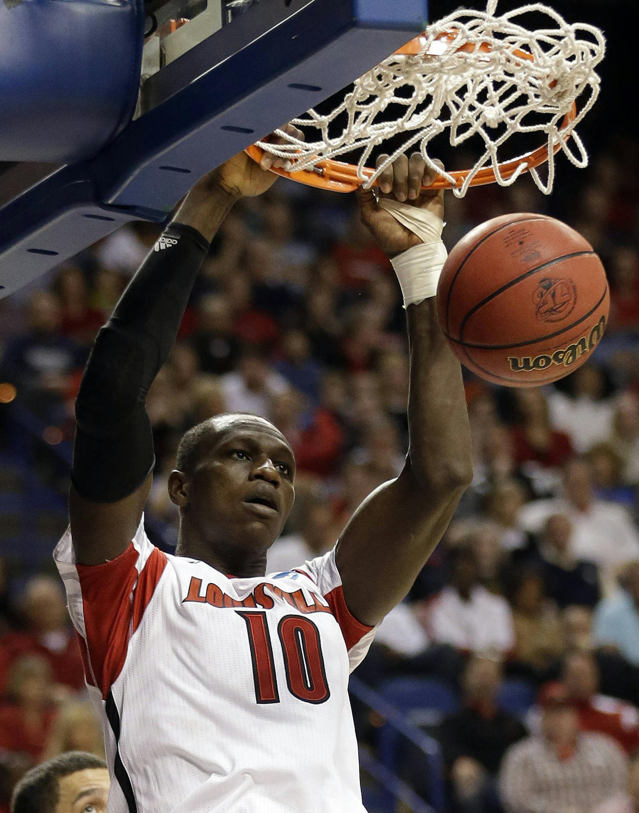 FILE - In this March 23, 2013 file photo, Louisville center Gorgui Dieng (10) scores in the second half of a third-round NCAA college basketball tournament game against Colorado State in Lexington, Ky. Dieng is one of the prospects at the NBA Draft Thursday, June 27, 2013 in New York. (AP Photo/John Bazemore, File) ORG XMIT: MIN2013062800103227