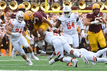 Trey Potts (3) went airborne on this second-quarter play for the Gophers against Bowling Green on Sept. 11.