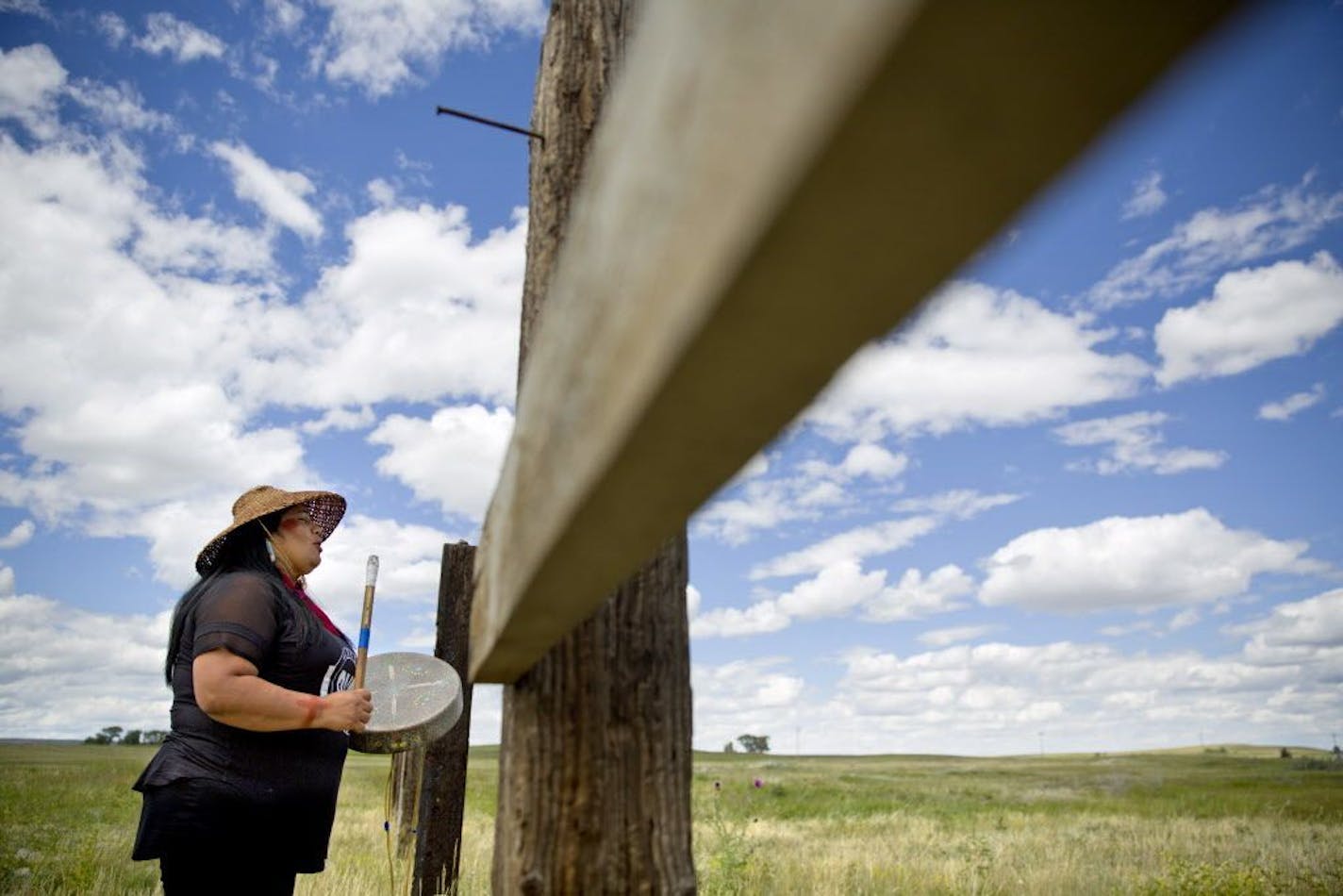 Roxanne White, whose aunt was murdered in 1996, sings and drums a women's warrior and honor song created for missing and murdered indigenous women, before joining a search in Valier, Mont., for Ashley HeavyRunner Loring, who disappeared last year from the Blackfeet Indian Reservation, Wednesday, July 11, 2018. For many in Native American communities across the nation, the problem of missing and murdered women is deeply personal.