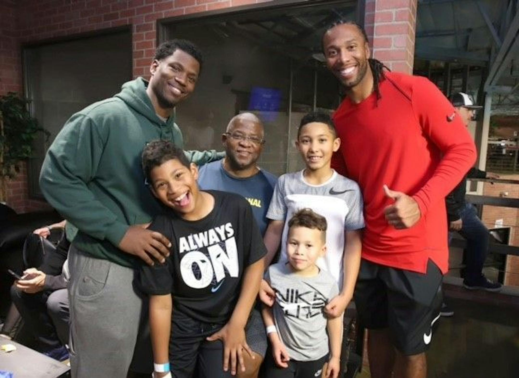 Three generations of Fitzgerald's. Left to right: Marcus, his son Jaylen, Larry, Sr., Devin, Apollo and their dad, Larry Jr.
