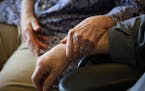 FILE &#x2014; A comforting hand, at a nursing home in the Bronx