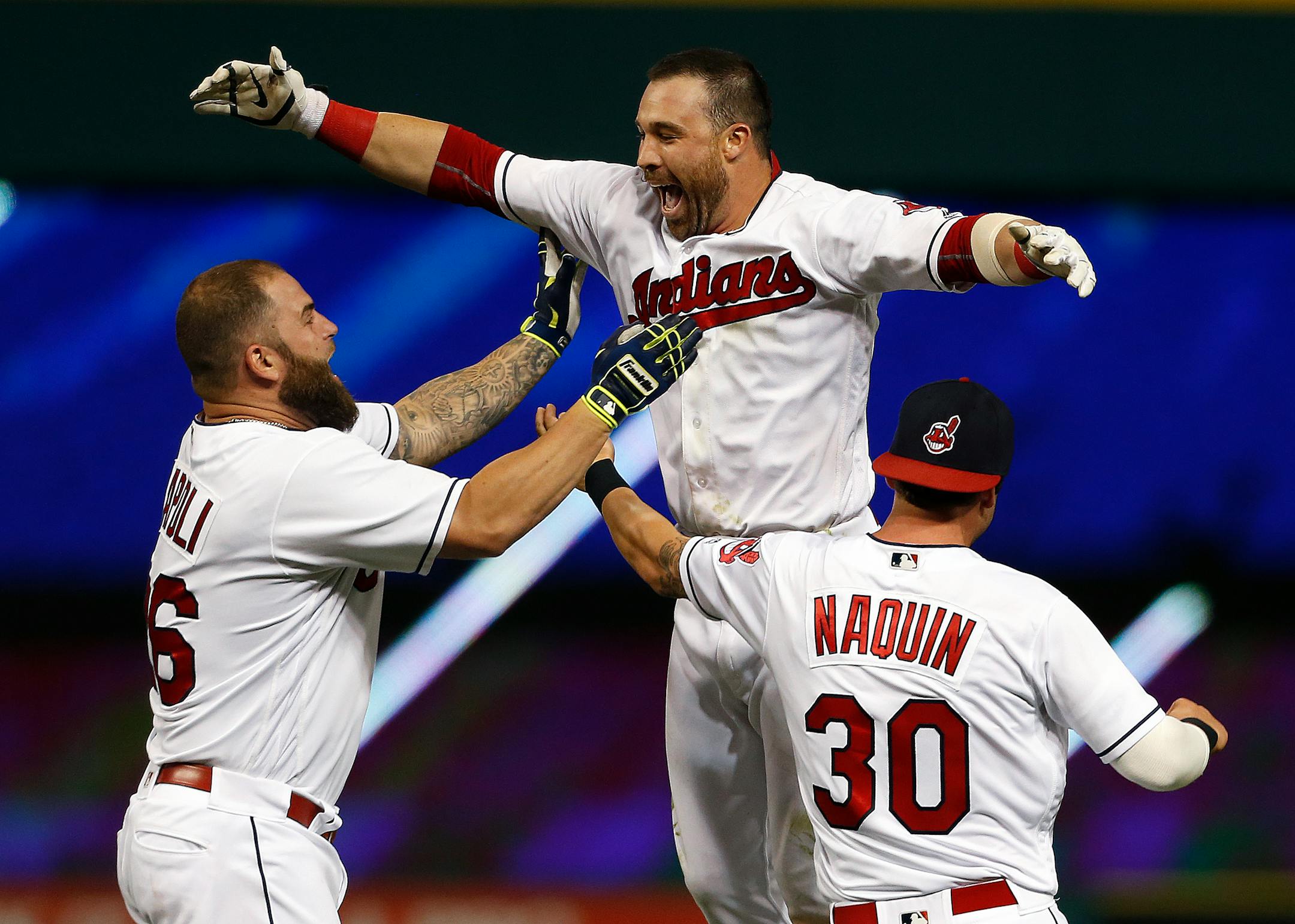 Cleveland's Jason Kipnis, center, celebrated with Mike Napoli, left, and Tyler Naquin after hitting the winning single in the 10th inning against the Twins.