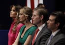 FILE - In this Sunday, Oct. 9, 2016 file photo, from left, Melania Trump, Ivanka Trump, Eric Trump and Donald Trump, Jr. wait for the second president