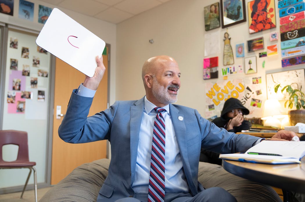 Joe Gothard, St. Paul Public Schools superintendent, chats in a reading class at American Indian Magnet School in St. Paul.