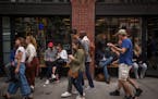FILE ' People on smartphones in New York, Sept. 9, 2017. 'At the core of the frenzied interest in Elon Musk's acquisition of Twitter is an intuition t