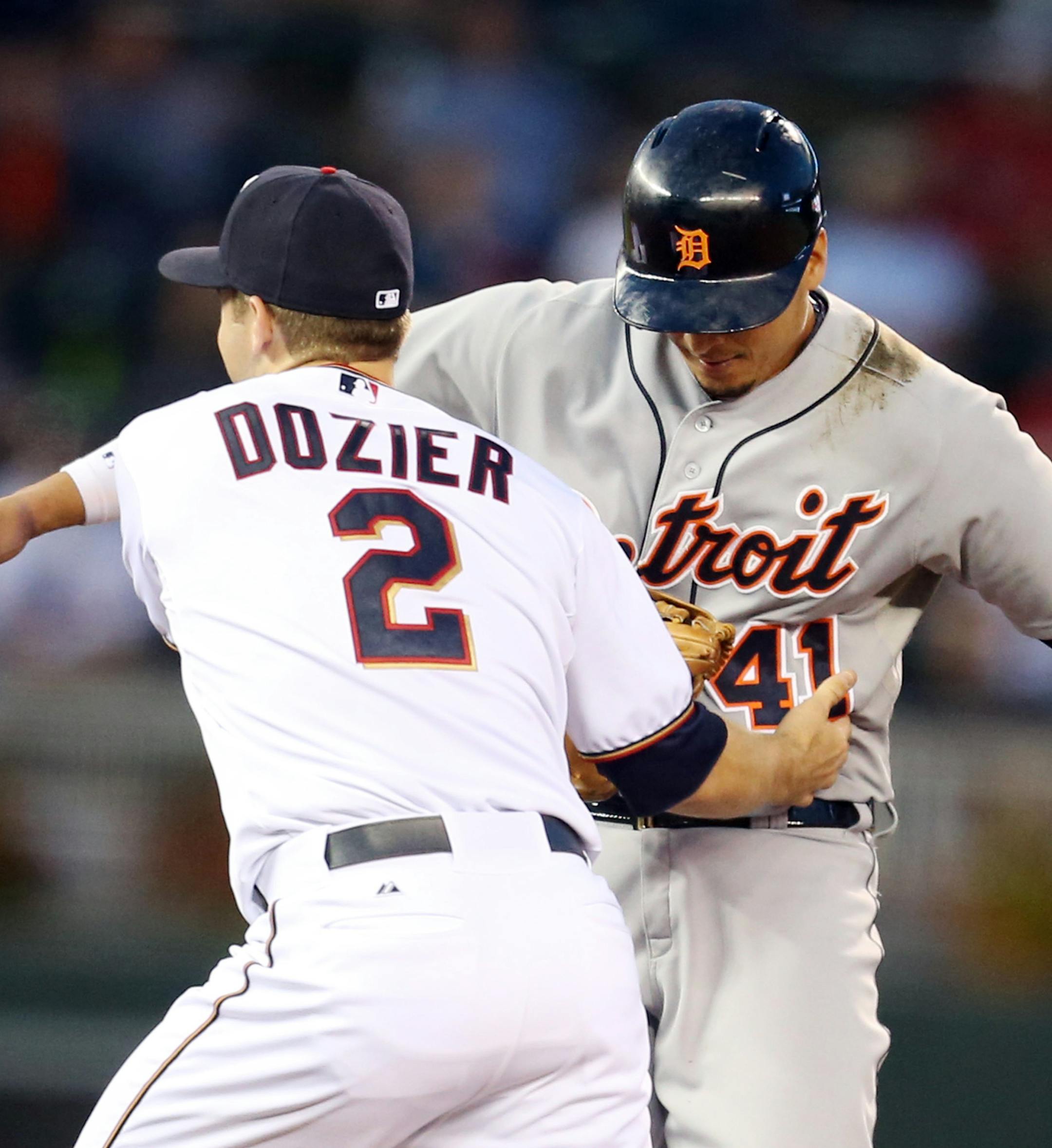 Detroit Tigers designated hitter Victor Martinez (41) was tagged out in the first inning by Minnesota Twins second baseman Brian Dozier (2) in a round down between second and third base at Target Field Tuesday September 15, 2015 in Minneapolis, MN. ] The Minnesota Twins hosted the Detroit Tigers Tuesday night at Target Filed . Jerry Holt/ Jerry.Holt@Startribune.com