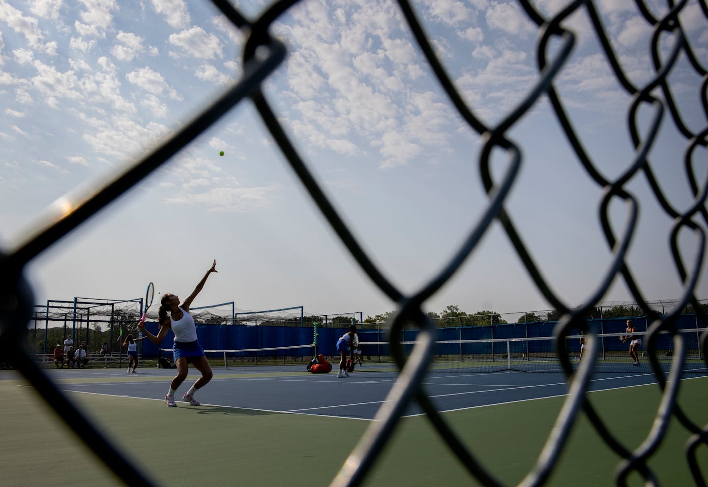 A Blake player served the ball during a match vs. Minnetonka. ] CARLOS GONZALEZ • cgonzalez@startribune.com – Minnetonka, MN – August 25, 2020, Blake at Minnetonka Girl's Tennis, two pretty good teams playing early in the season. what's different/same for playing in the age of COVID.