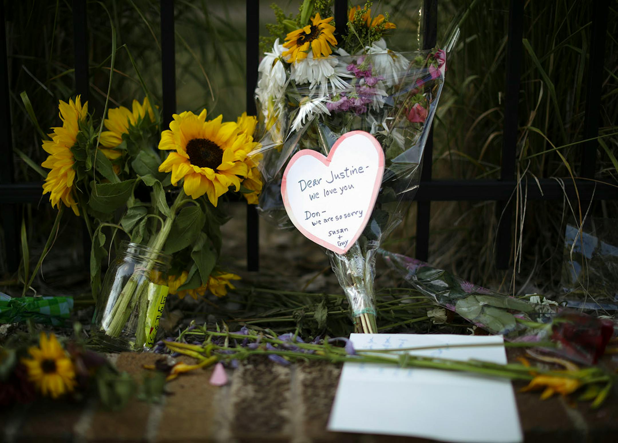 Detail of the larger memorial on the sidewalk on W. 51st. St. in the Fulton neighborhood Monday night.