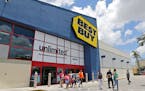 In this Monday, May 22, 2017, photo, customers walk out of a Best Buy store in Hialeah, Fla. Best Buy Co. Inc. reports earnings, Thursday, May 25, 201