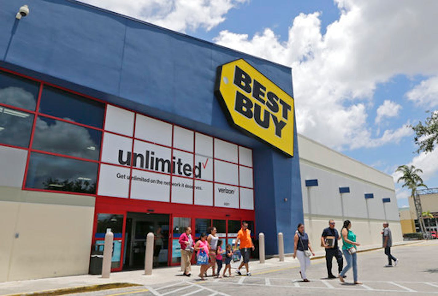 In this Monday, May 22, 2017, photo, customers walk out of a Best Buy store in Hialeah, Fla. Best Buy Co. Inc. reports earnings, Thursday, May 25, 2017. (AP Photo/Alan Diaz)