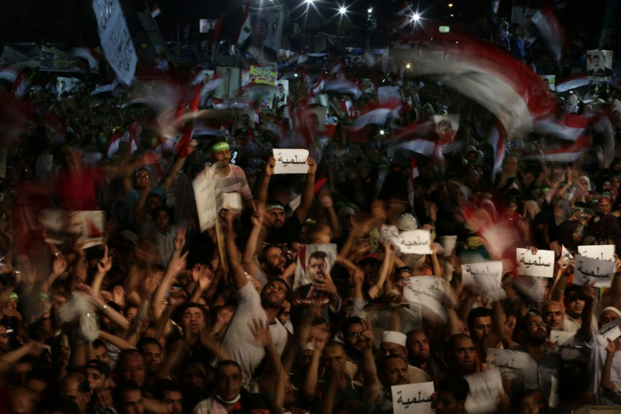 Supporters of Egypt's ousted President Mohammed Morsi chant slogans against Egyptian Defense Minister Gen. Abdel-Fattah el-Sissi outside Rabaah al-Adawiya mosque, where supporters of Egypt's ousted President Mohammed Morsi have installed a camp and hold daily rallies at Nasr City, in Cairo, Egypt, Friday, Aug. 2, 2013. Authorities outlined plans Friday to break up two sit-ins by supporters of deposed President Mohammed Morsi, saying they would set up a cordon around the protest sites, and riot p