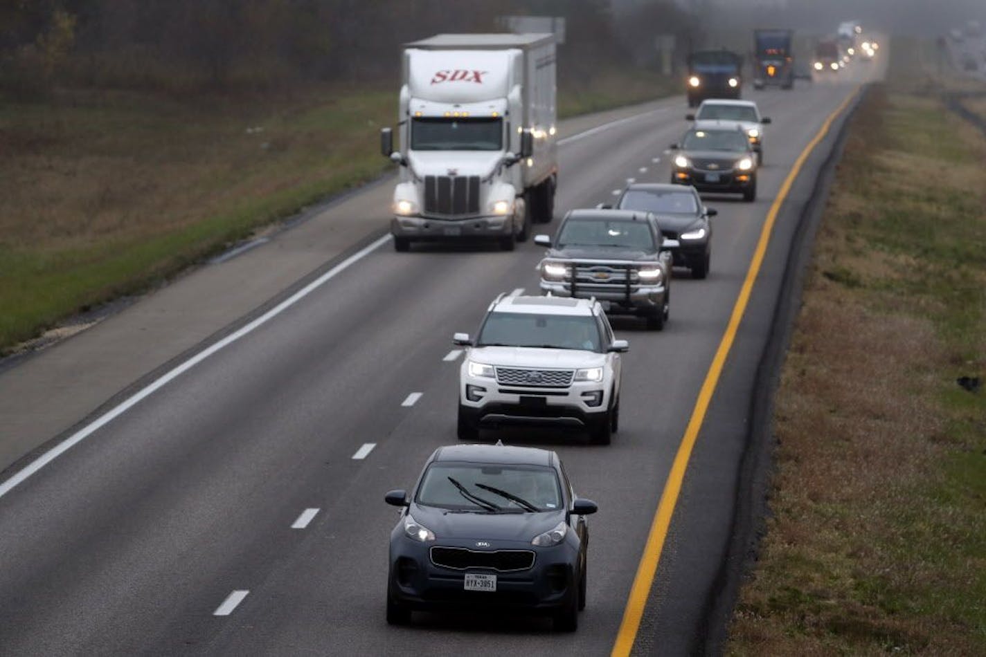 A driver stayed in the passing lane as traffic accumulates behind along Interstate 70 in Montgomery County, Mo. Minnesota is considering a "slowpoke" law to crack down on such drivers.