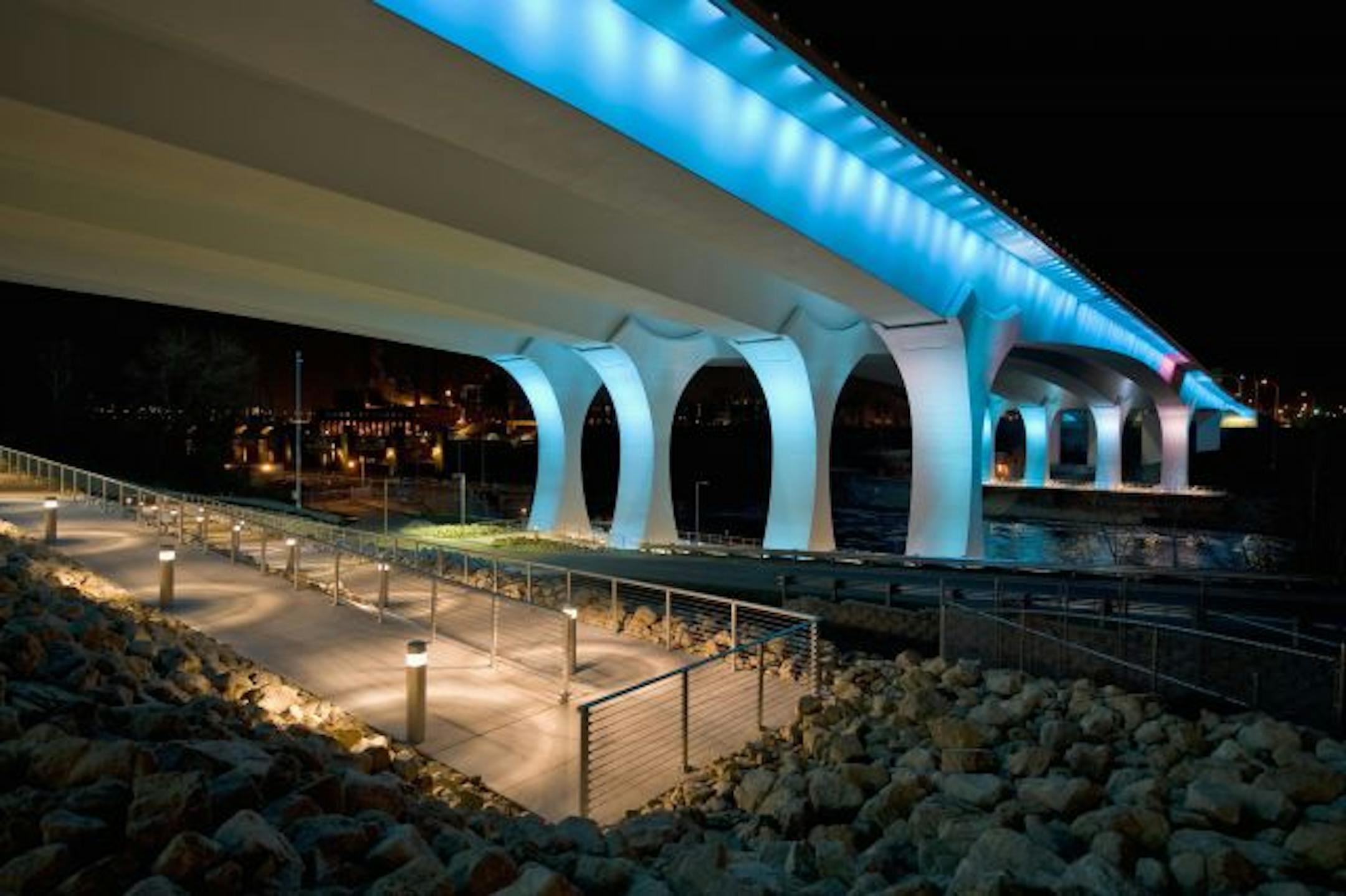 The 35W bridge is bathed in blue.