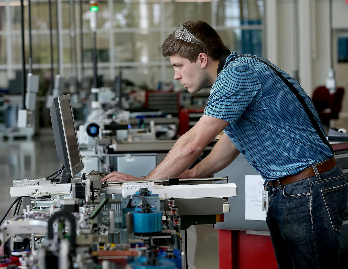 Engineer Kyle Johnson worked on one of the credit card machines that are manufactured at Entrust Datacard, Monday, June 2, 2015 in Shakopee, MN. ] (ELIZABETH FLORES/STAR TRIBUNE) ELIZABETH FLORES &#x2022; eflores@startribune.com