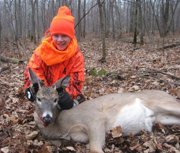Kaitlyn Zenner with her first-ever deer, shot Sunday near Pillager.