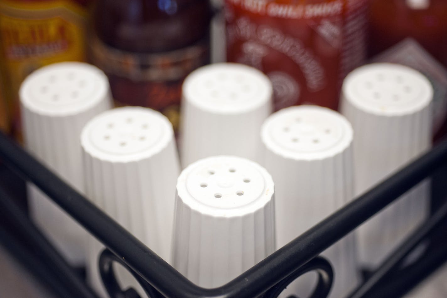 Boston Market has removed the salt shakers from the tables in their restaurants nationwide and placed them with other condiments on the beverage dispenser table, as seen in their Alexandria Va., eatery, Tuesday, May 14, 2013. A surprising new report questions how sharply Americans should cut back on salt. Make no mistake: Most Americans eat way too much, not just from salt shakers but because of sodium in processed foods. The Institute of Medicine said Tuesday there's no evidence that cutting we