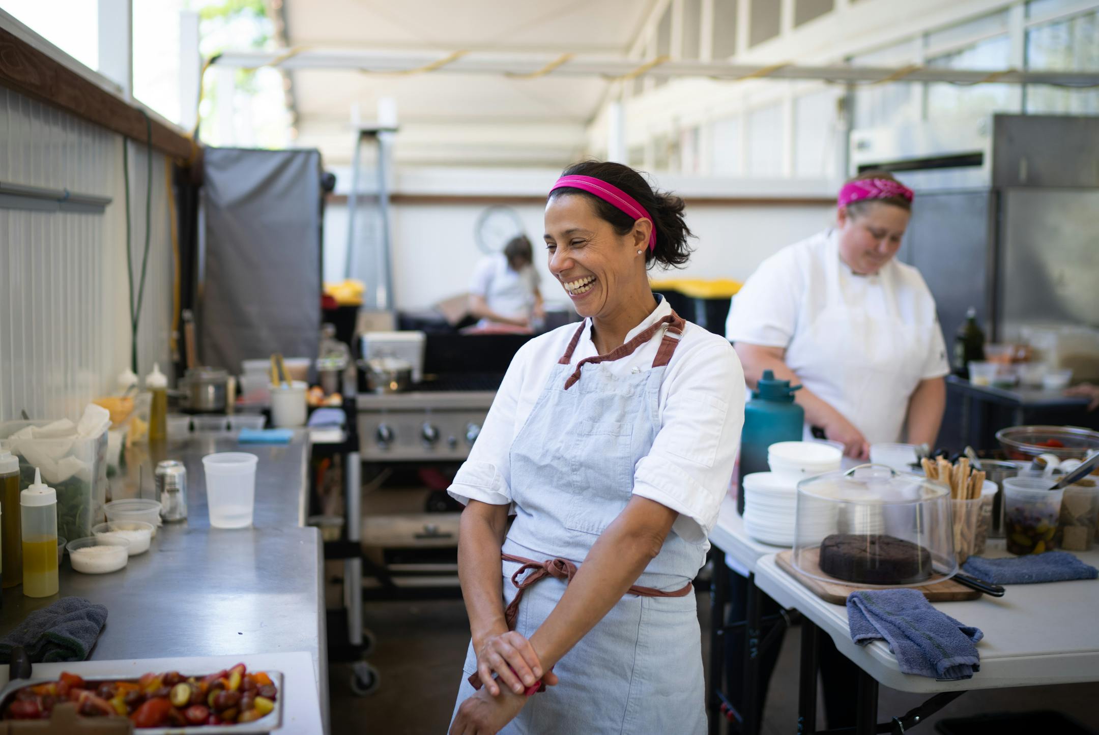 Chef Jo Seddon laughed while working in the outdoor kitchen at Gia at the Lake.