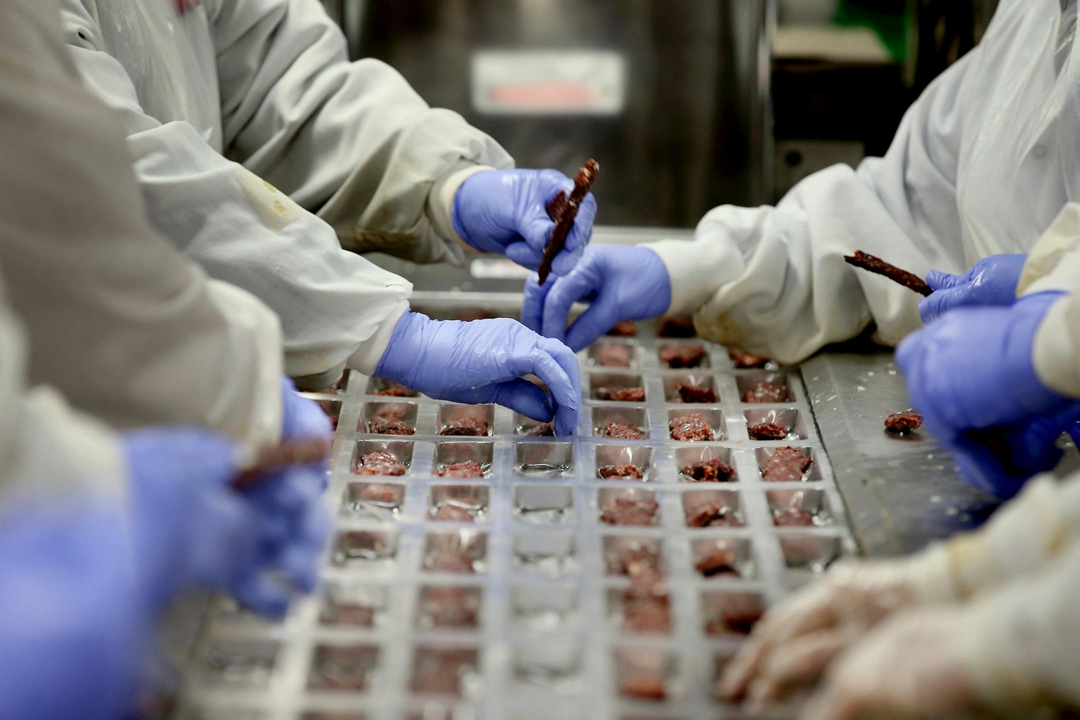 Workers processed Jack Links beef jerky in the packaging area, Monday, October 19, 2015 in Minong,Wis.