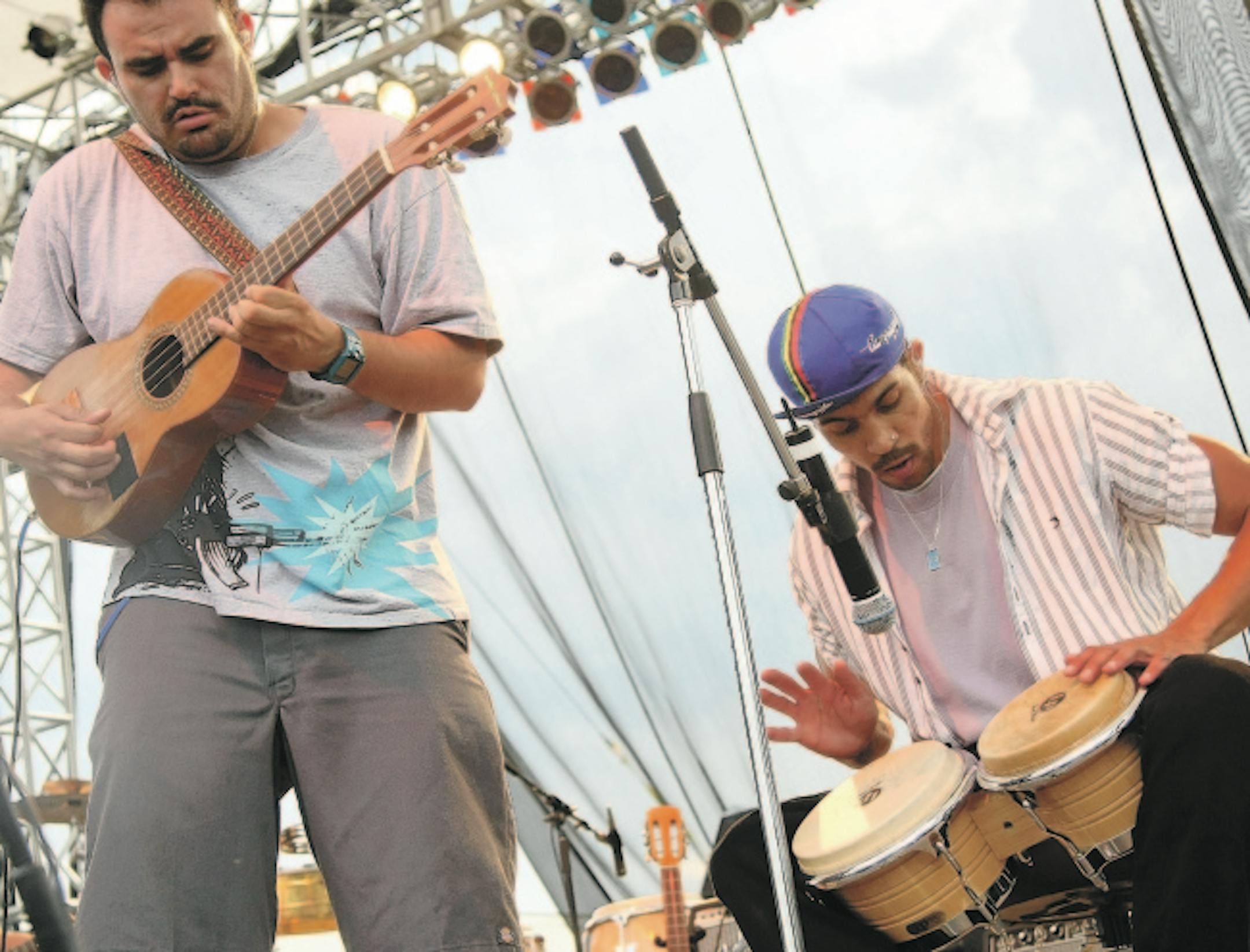 TOM WALLACE � twallace@startribune.com
Assign:#00004871A slug: night0920 September 19, 2008
The second annual McNally Smith River Rocks Festival has changed from an all-local two-day event to one with national headliners, including the Roots, Jakob Dylan, O.A.R., Mike Doughty and Live. Local favorites Semisonic, reuniting on Sat., still might be the big draw, though.[ Vli Bella and Justin Poree' of Ozomatli take it home during the concert.
Molly Steinke, festival publicist 952 278 3142 ofc; 612