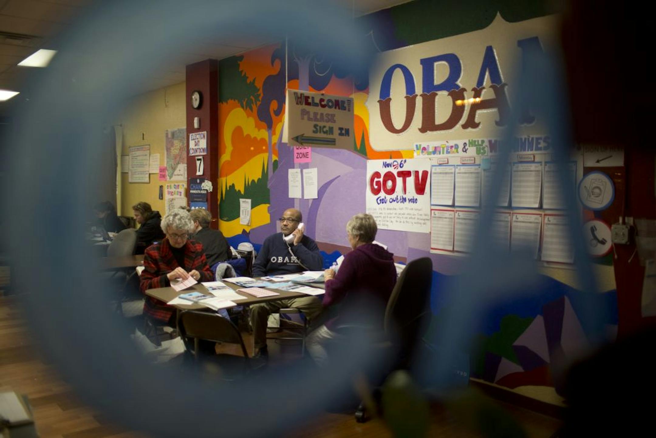Volunteers at the Obama for America office in St. Paul, Minn. made get out the vote phone calls and prepared campaign literature Monday night, October 29, 2012. Elmore James of St. Paul, center, made get out the vote phone calls while Kathy Oakley, left, also of St. Paul, prepared literature at the Obama campaign office on Selby Ave. in St. Paul Monday night.