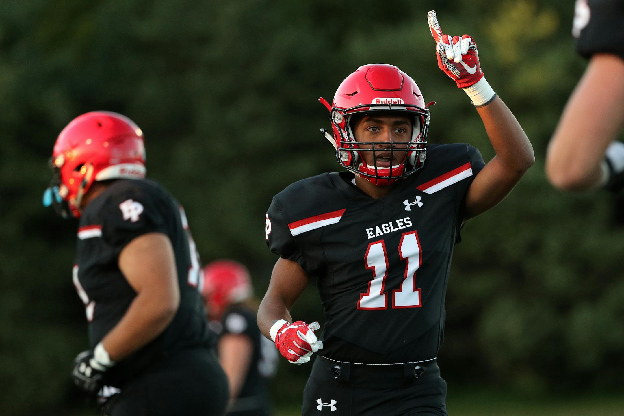 Eden Prairie wide receiver Daejon Wolfe (11) celebrated after scoring a touchdown in the first half in a 41-13 rout of Lakeville North on Friday.