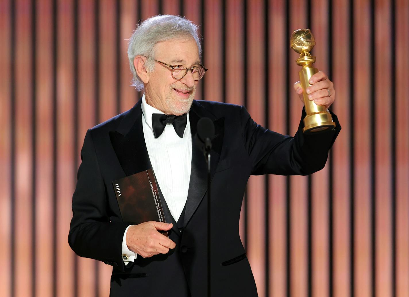 This image released by NBC shows Steven Spielberg accepting the Best Director award for "The Fabelmans" during the 80th Annual Golden Globe Awards at the Beverly Hilton Hotel on Tuesday, Jan. 10, 2023, in Beverly Hills, Calif. (Rich Polk/NBC via AP)