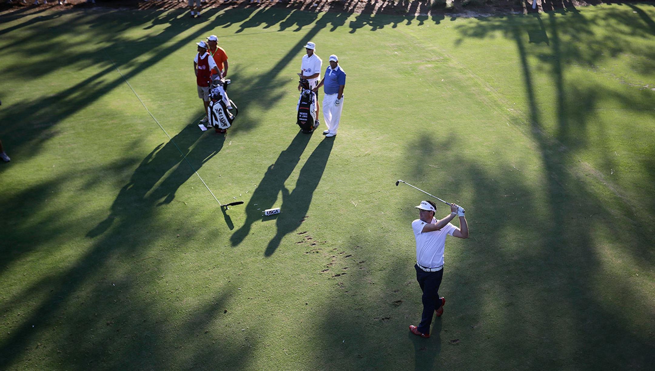 Keegan Bradley watches his tee shot on the 17th hole during the third round of the U.S. Open golf tournament in Pinehurst, N.C., Saturday, June 14, 2014.