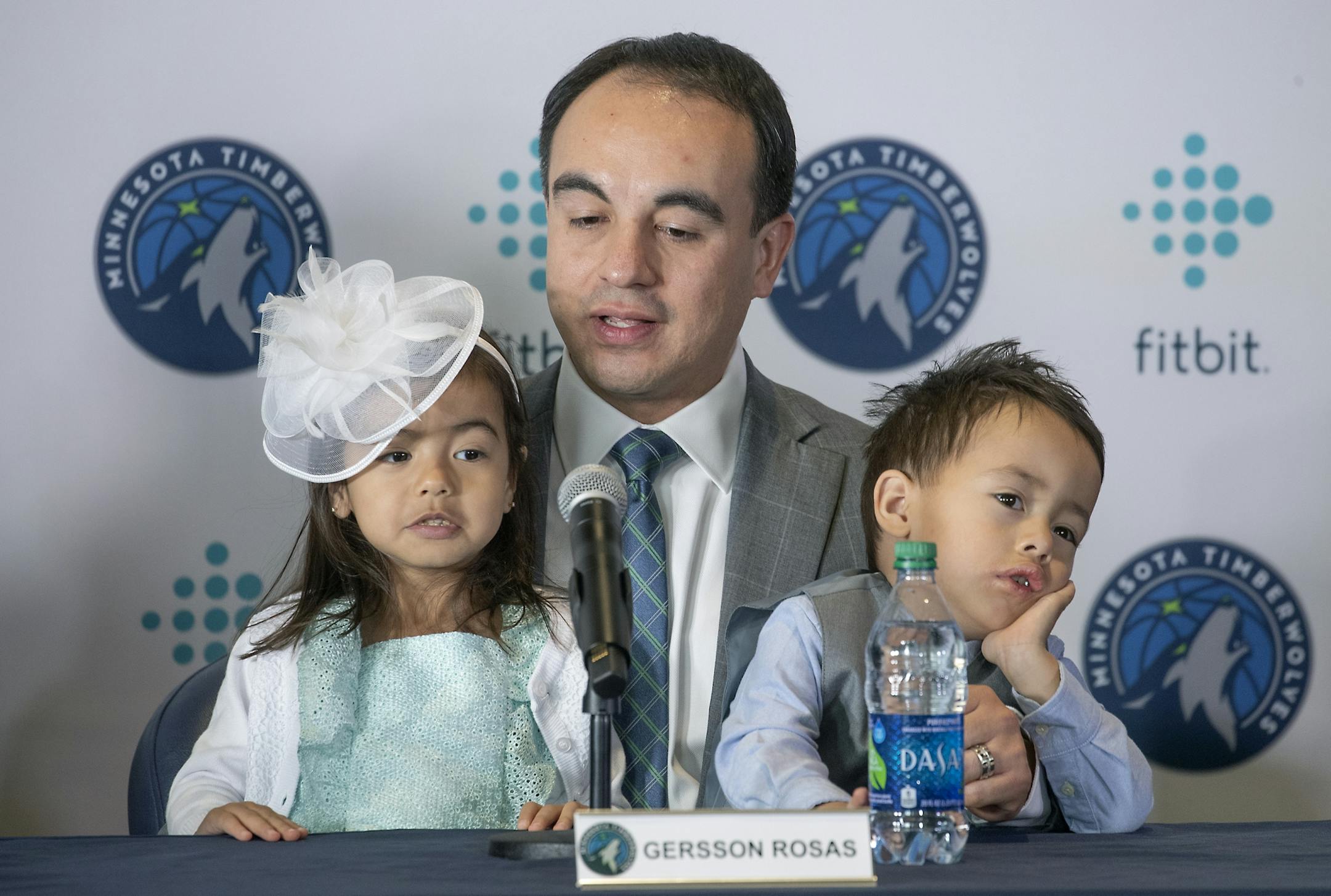 Minnesota Timberwolves new President of basketball operations Gersson Rosas addressed the media as his 3-year-old twins Giana, left, and Grayson sat on his lap during a press conference at the Target Center, Monday, May 6, 2019.