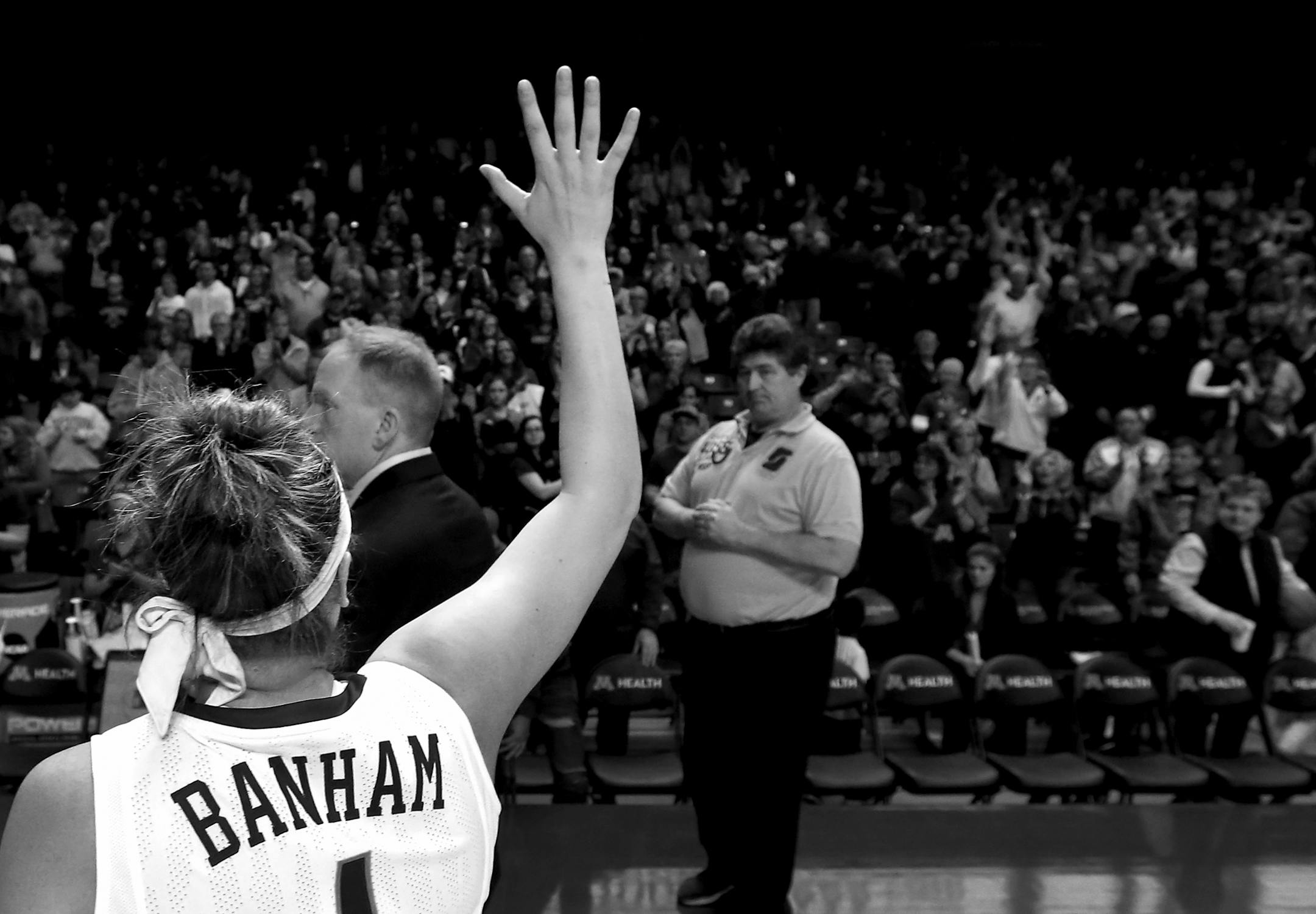 Rachel Banham (1) waved goodbye to fans as she walked off the court after playing in her final game for the University of Minnesota. South Dakota beat Minnesota by a final score of 101-89 in the WNIT. Banham finished with 37-points.