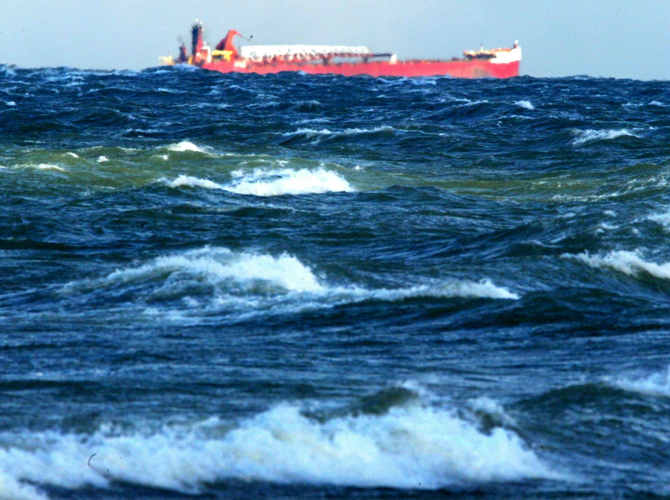 The wind whips the waters of Lake Michigan in the U.P as a freighter crawls by on the horizon. ORG XMIT: MIN2014062815413541