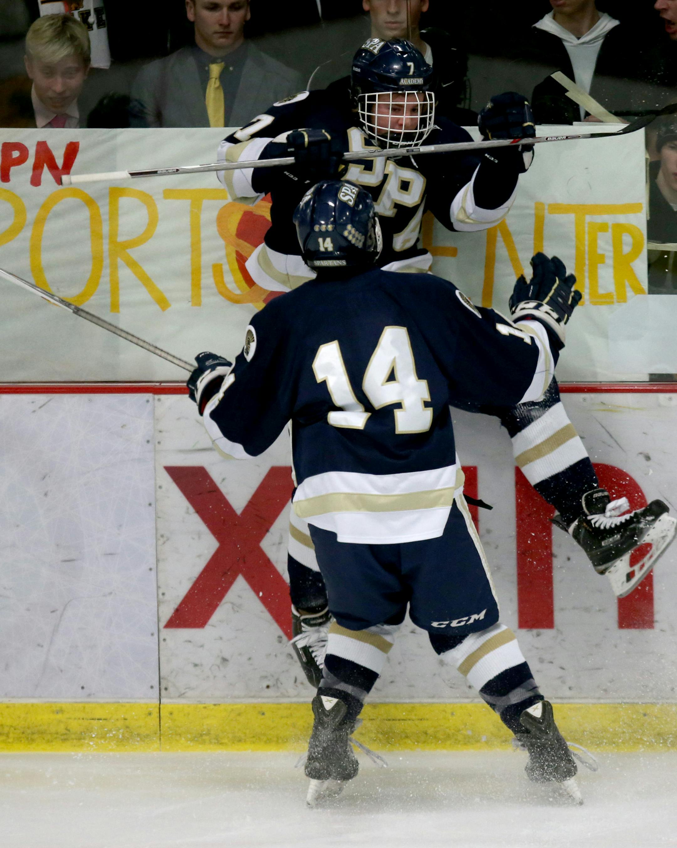 St. Paul Academy Cullen McCabe celebrated with teammate Noel Parker after McCabe scored their first goal in the first period. ] (KYNDELL HARKNESS/STAR TRIBUNE) kyndell.harkness@startribune.com St. Paul Academy vs Mahtomedi in sectional finals in Roseville , Min., Friday, February 27, 2015.