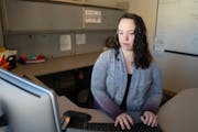 Alyssa Raway, a child & family intake social worker, completes a child protection intake for screening using the social services information system at