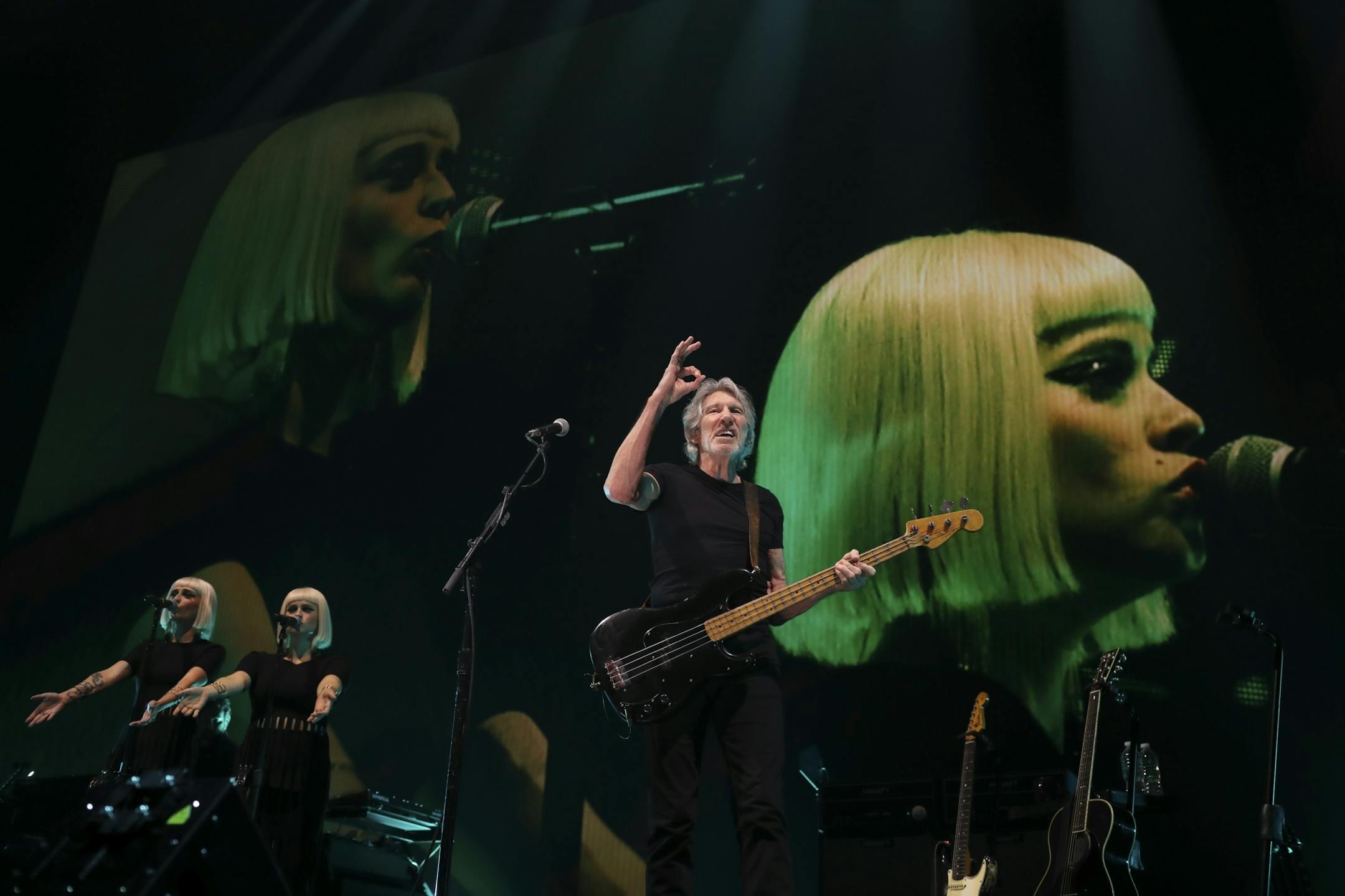Roger Waters during "Time," the third song in his set Wednesday night at Xcel Energy Center in St. Paul. With him were Holly Laessig, left, and Jess Wolfe of Lucius, on backup vocals