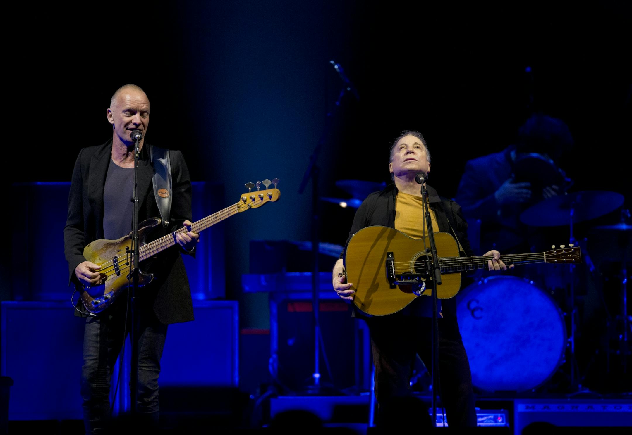 Longtime New York neighbors Sting and Paul Simon decided to hit the road and tour together. The Paul Simon & Sting: On Stage Together tour stopped at Xcel Energy Center in St. Paul Sunday night, February 23, 2014. Sting, left, and Paul Simon performing Sting's "Brand New Day" to open their set Sunday night at Xcel Energy Center.