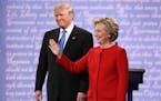 Hillary Clinton and Donald Trump take the stage for their first presidential debate, at Hofstra University in Hempstead, N.Y., Sept. 26, 2016. (Damon 