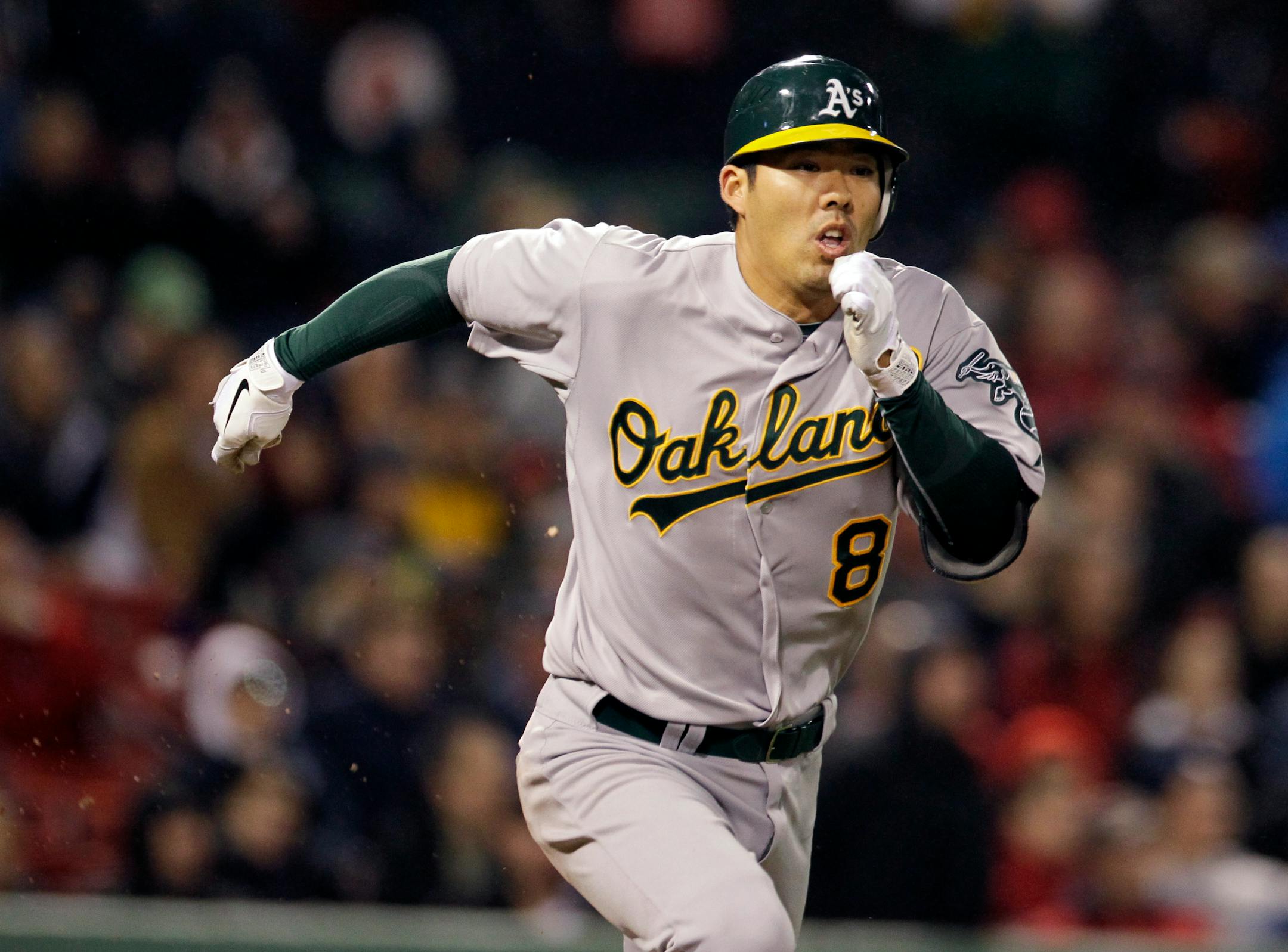 Oakland Athletics' Kurt Suzuki runs to first on a ground out during the sixth inning of a baseball game against the Boston Red Sox at Fenway Park in Boston, Tuesday, May 1, 2012. (AP Photo/Elise Amendola)