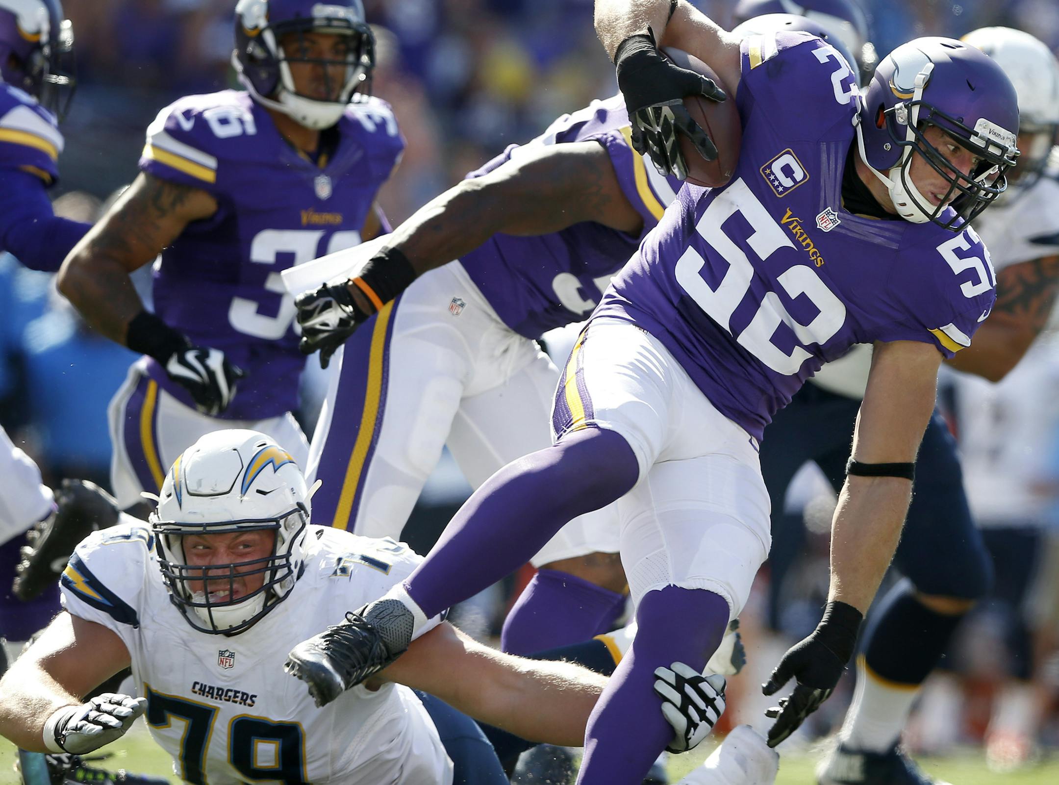 Minnesota Vikings linebacker Chad Greenway (52) broke away from Kenny Wiggins (79) during an interception return for a 91-yard touchdown in the fourth quarter. ] CARLOS GONZALEZ &#xef; cgonzalez@startribune.com - September 27, 2015, TCF Bank Stadium, Minneapolis, MN, NFL, Minnesota Vikings vs. San Diego Chargers