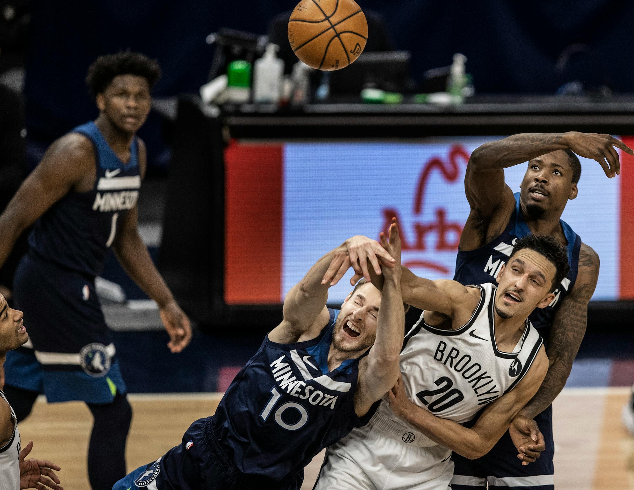 Minnesota Timberwolves forward Jake Layman (10) battled Brooklyn Nets guard Landry Shamet (20) for a loose ball at Target Center.