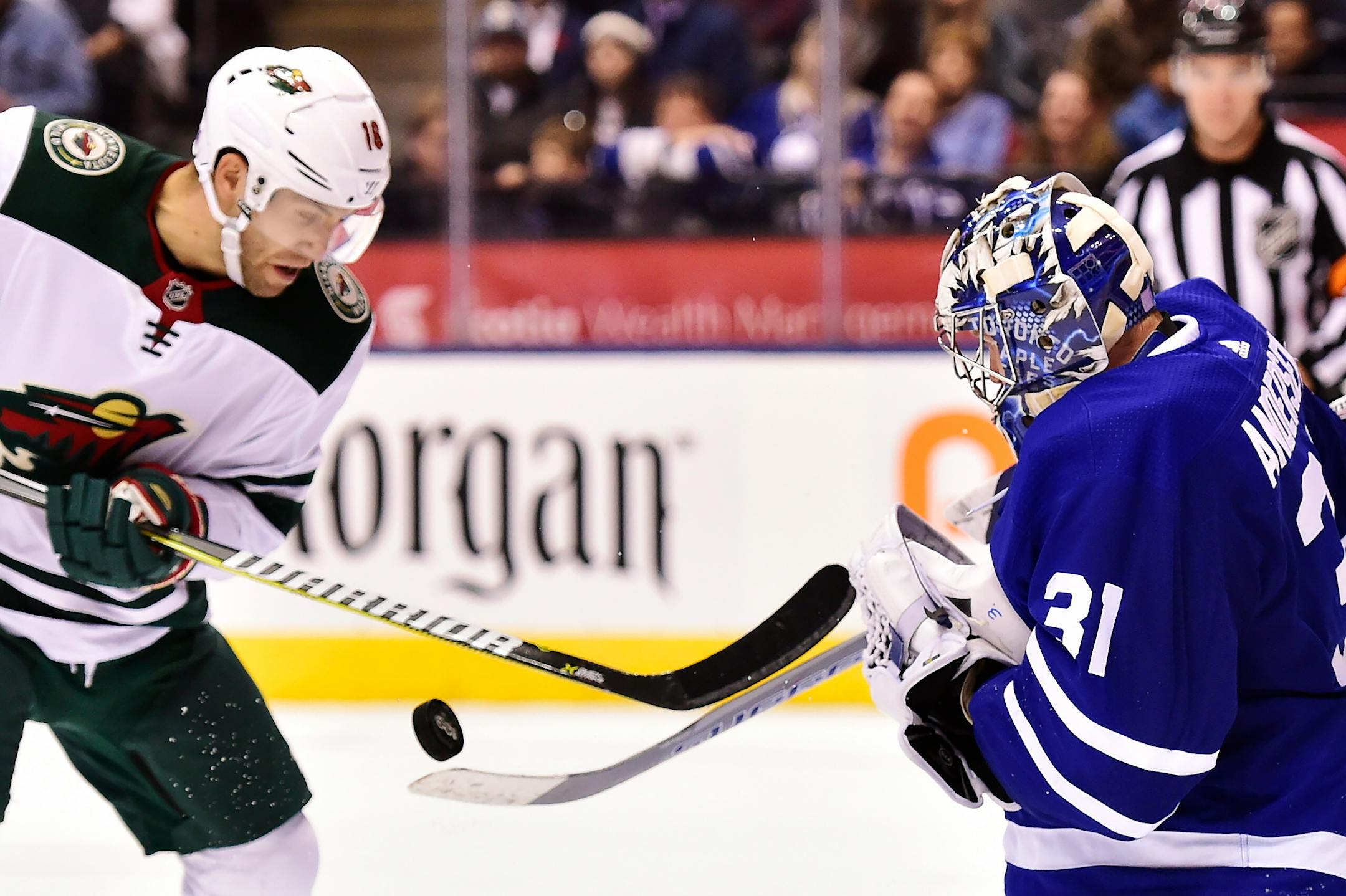 Minnesota Wild left wing Jason Zucker (16) looks for a rebound on a save by Toronto Maple Leafs goalie Frederik Andersen (31) during third period NHL hockey action, in Toronto on Wednesday, Nov. 8, 2017. THE CANADIAN PRESS/Frank Gunn/The Canadian Press via AP)