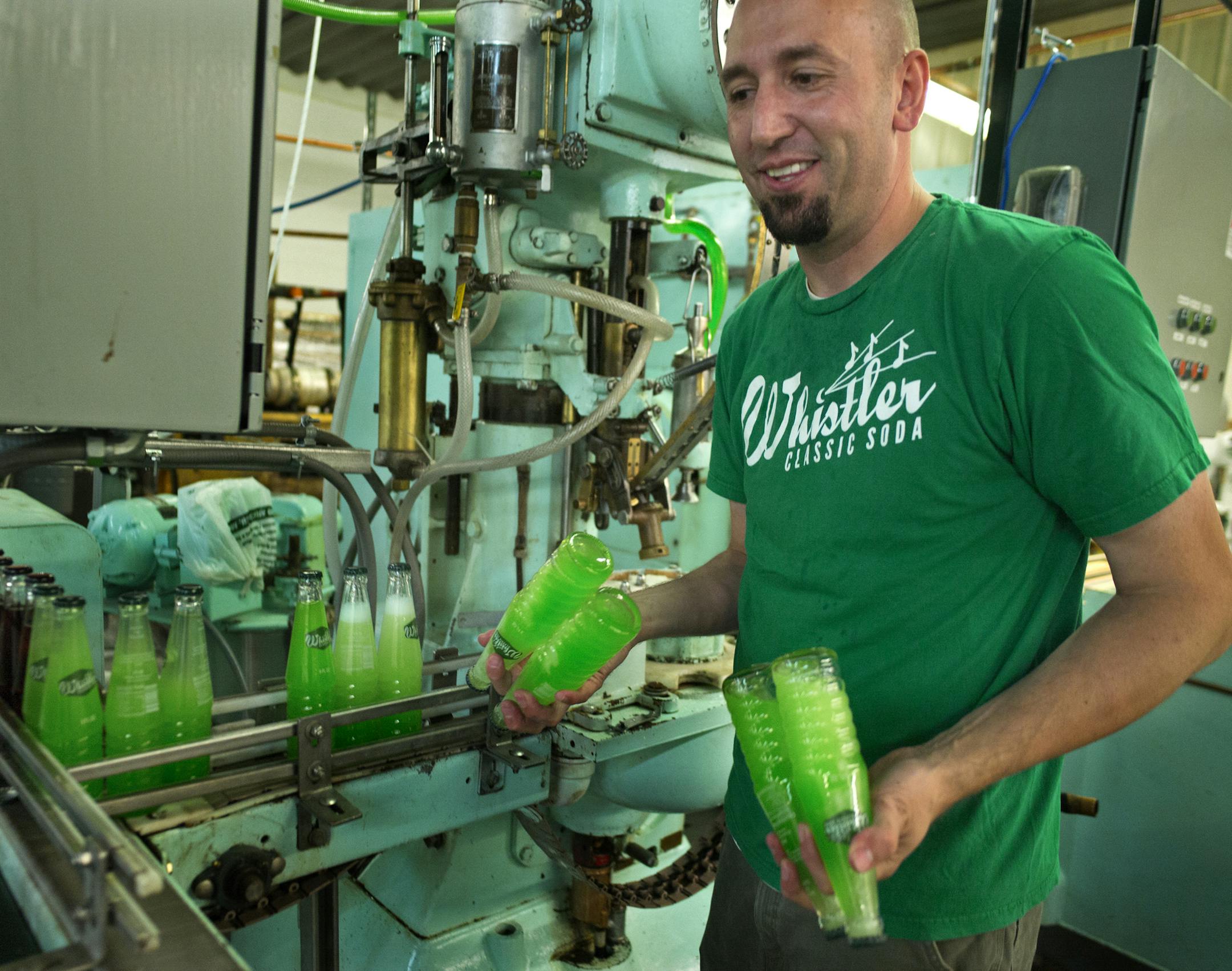 In a warehouse in Forest Lake, Jesse Hopkins, of Blaine, launched Whistler Classic Soda, a start-up beverage company that is producing a line of vintage inspired gourmet sodas bottled in returnable glass bottles. Apparently, he is the only glass-bottler of soda in Minnesota. The old fashion machine which injects the syrup, lime in this case, into the bottle before the carbonated water requires a little shaking .]Richard Tsong-Taatarii/rtsong-taatarii@startribune.com