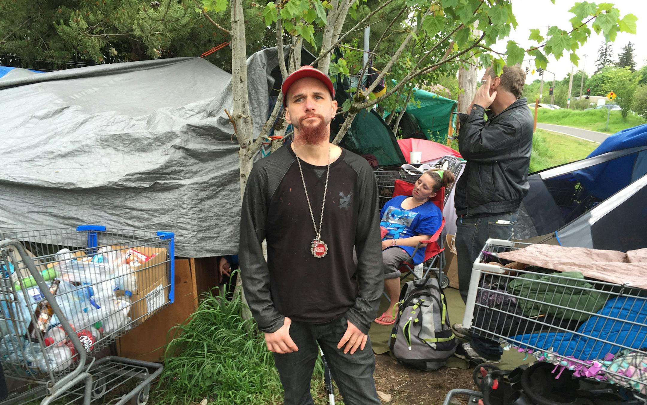 Robert Mendez has been living in this tent camp off the Springwater Corridor, a biking path and greenbelt, in southeast Portland. Under a new "safe sleep policy," tents must be taken down during the day, and this camp has been targeted to be taken down by police. (Hal Bernton/Seattle Times/TNS)