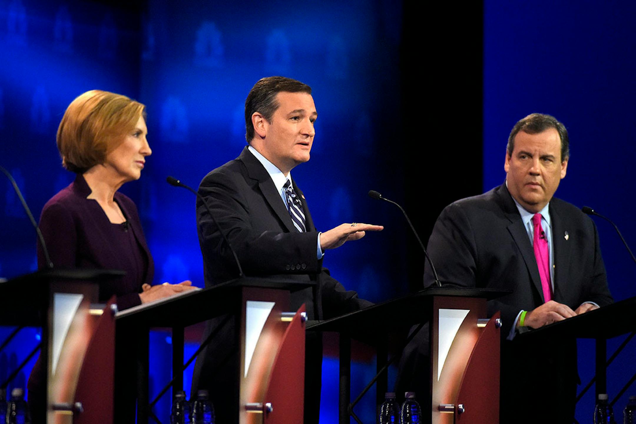 Ted Cruz, center, speaks as Carly Fiorina, left, and Chris Christie look on during the CNBC Republican presidential debate at the University of Colorado, Wednesday, Oct. 28, 2015, in Boulder, Colo.