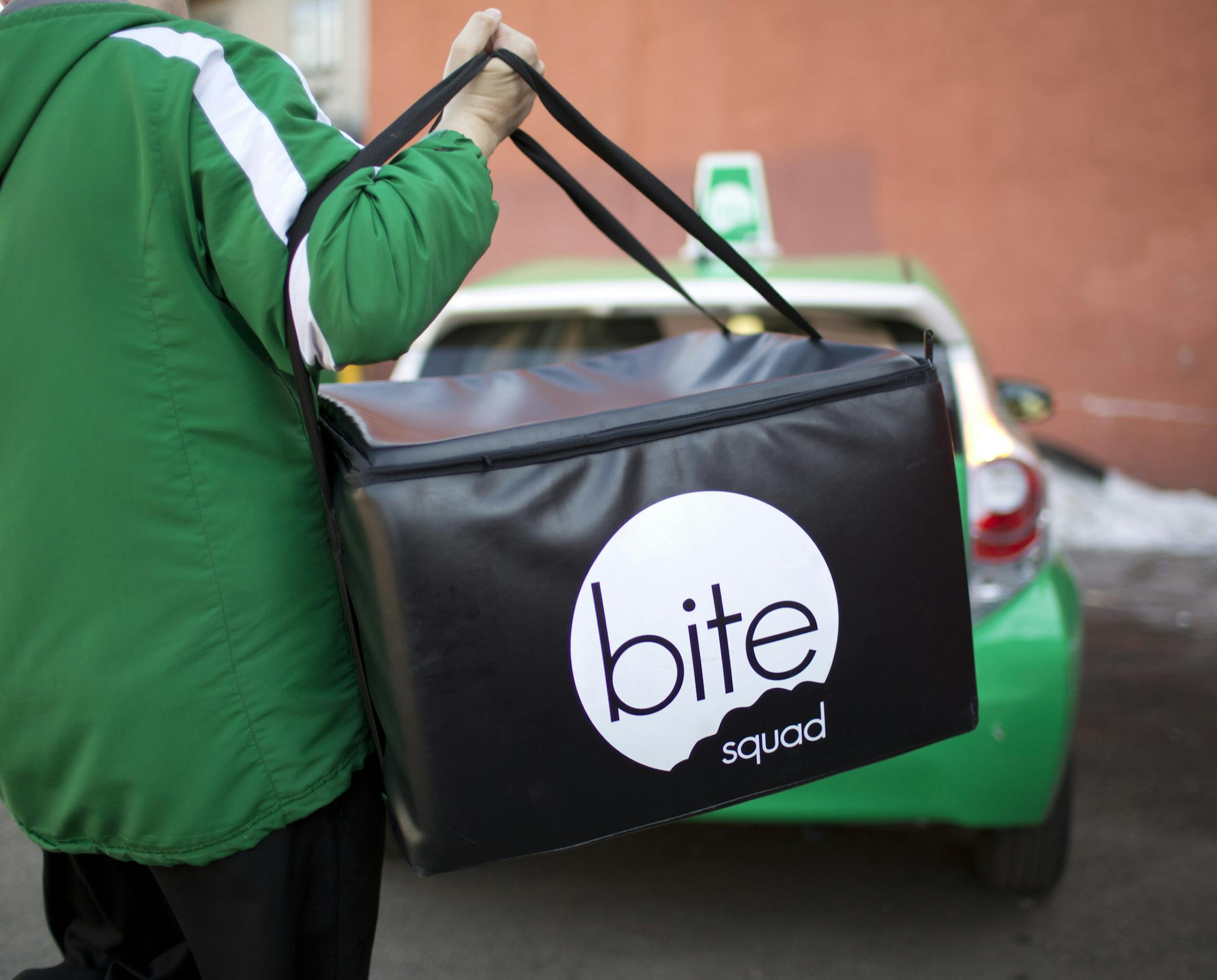 Restaurants are now outsourcing one of their onerous tasks, delivery. With food as a primary focus, restaurants can leave the delivery to a 3rd party. At least six delivery services have sprung up in the Twin Cities in the past year. Sean Dolan, a delivery driver for one of the new ones, Bite Squad, carried the food out to his vehicle that he was picking up at Pancho Villa's Bar & Grill on Eat Street in Minneapolis Thursday afternoon, April 4, 2013 before running it to an office building downtow